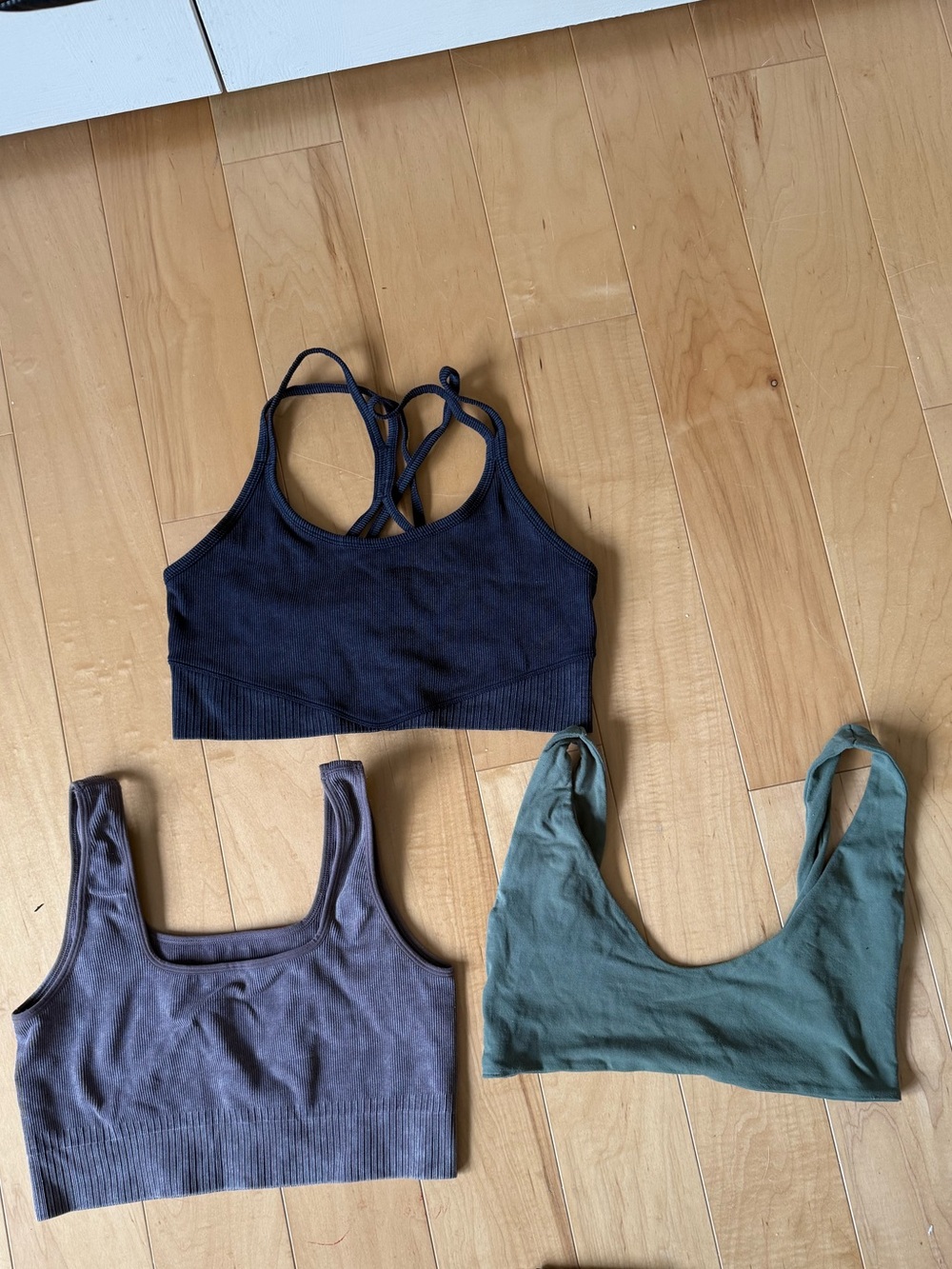three earth tone bralettes 🏔️